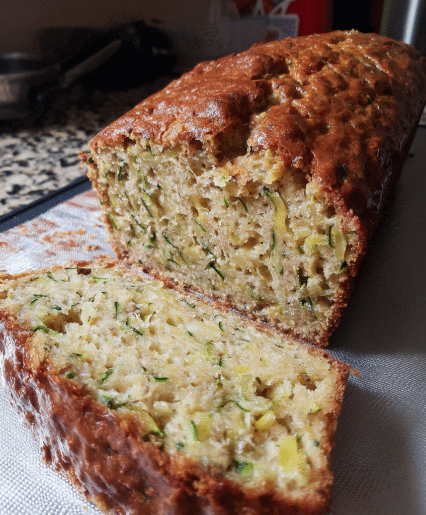 Sliced Banana Pineapple Zucchini Bread served with whipped cream