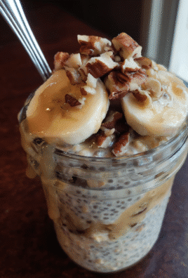 Overnight oats with banana and chia seeds in a jar, a healthy breakfast option.