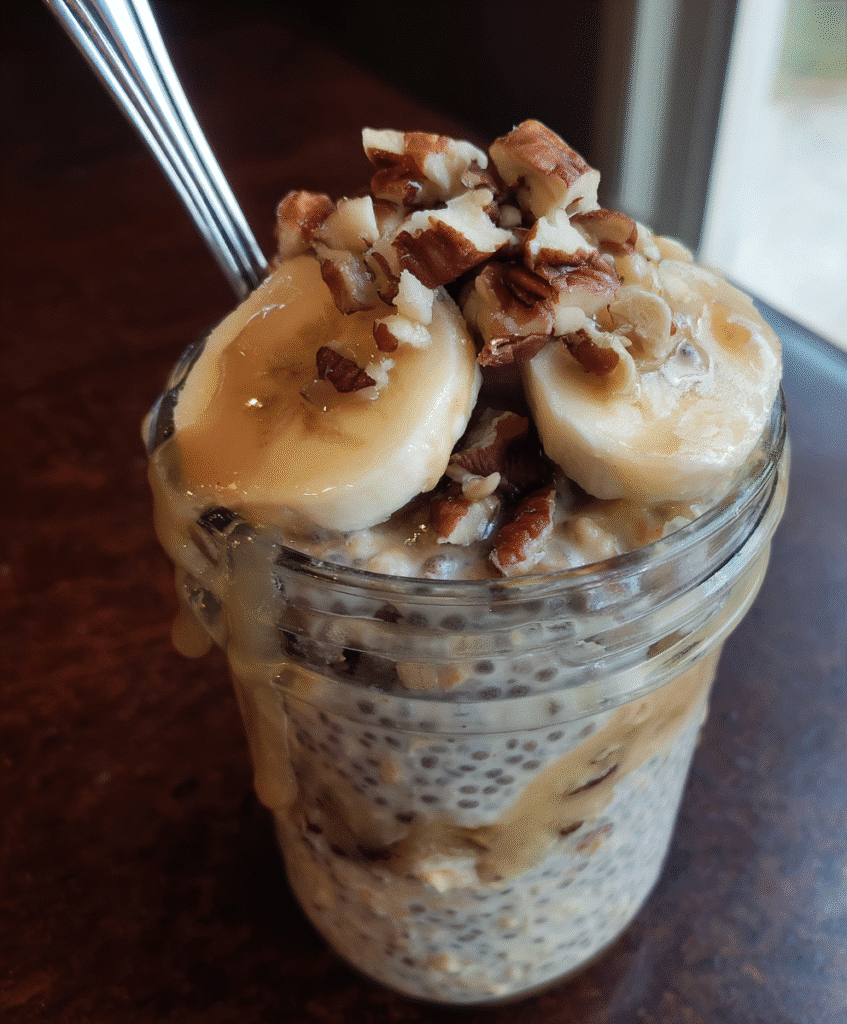 Overnight oats with banana and chia seeds in a jar, a healthy breakfast option.