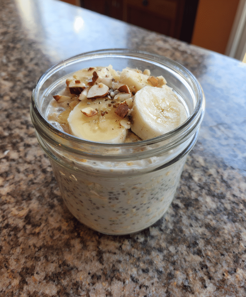 Preparing overnight oats with chia seeds and banana in a jar, ready for soaking.
