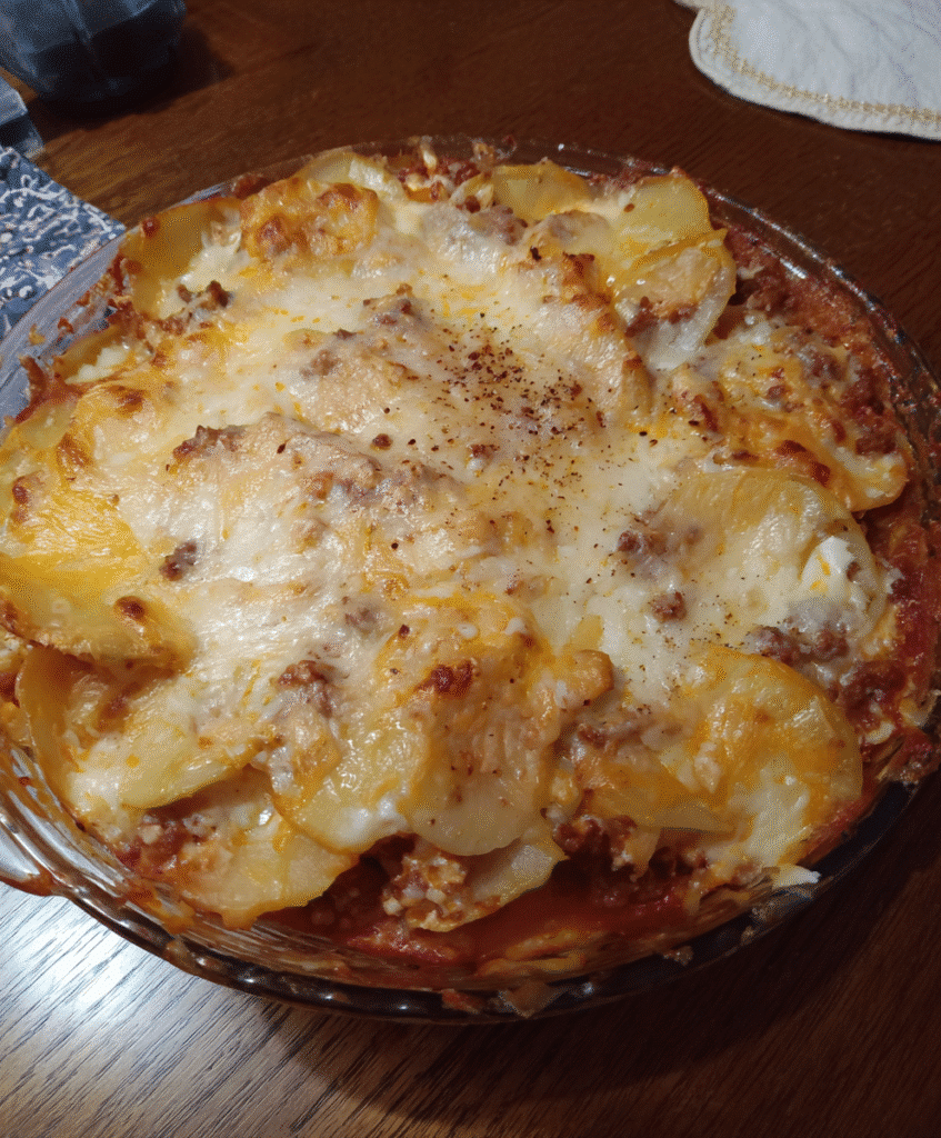 Serving Cheesy Potato Lasagna