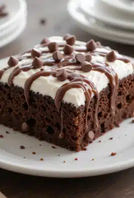 Chocolate Fudge Poke Cake sliced and served