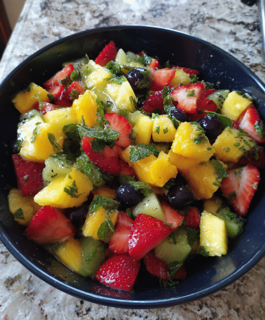 Step-by-step preparation of Fresh Fruit Salad with Honey Mint Lime Syrup
