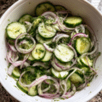 Fresh kitchen cucumber salad with red onion and dill