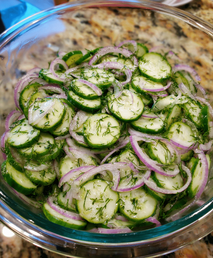 Served cucumber salad with feta and dill