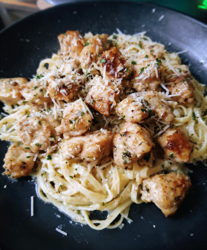 Ingredients for garlic butter chicken bites with creamy Parmesan pasta: chicken, butter, garlic, heavy cream, Parmesan, pasta, olive oil, and seasonings.