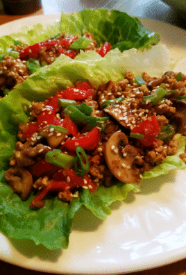 Healthy Chicken Lettuce Wraps served fresh on a white plate