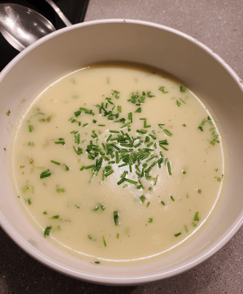 bowl of potato soup with toppings